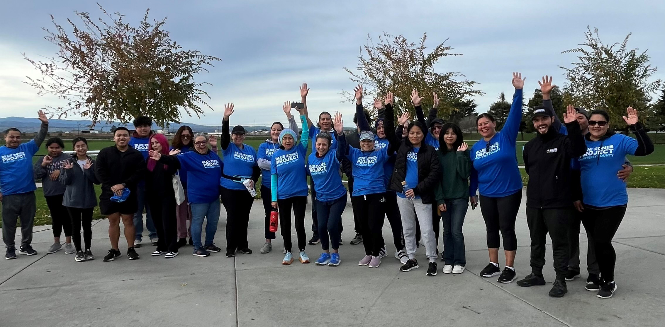 Group of people in blue shirts